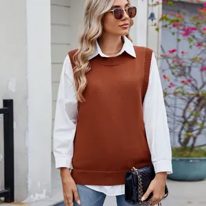 Women's rust brown knit sweater vest layered over a white shirt for casual style
