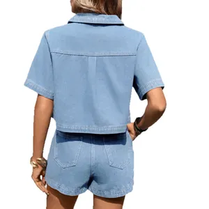 Back view of a washed blue denim two-piece set including short-sleeve jacket and shorts