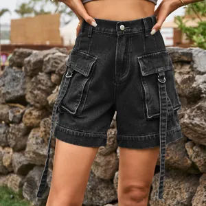 Close-up of women's black denim cargo shorts with utility pockets and strap detail