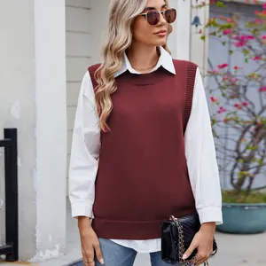 Close-up of a burgundy knit vest styled over a white shirt for a classic look