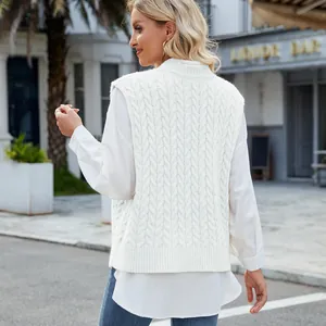 Back view of a chic white cable knit vest sweater with intricate twist rope patterns