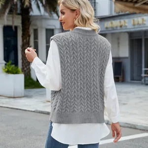 Back view detail of gray cable-knit sweater vest with intricate twist pattern