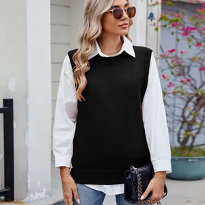Womens casual black knitted vest layered over a classic white long-sleeve shirt