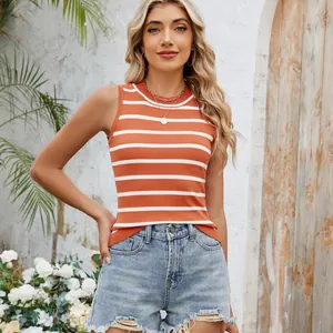 Model wearing retro orange and white striped slim knit tank top in a sunny garden setting