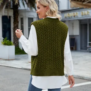 Back view of a vintage olive green cable-knit sleeveless sweater vest for women on model.