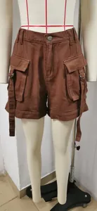 Detailed front view of brown cargo denim shorts with large flap pockets on a mannequin