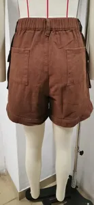 Back view of brown denim cargo shorts with elastic waist and dual rear pockets