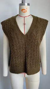 Detail of vintage V-neck cable knit sweater vest in olive green on mannequin