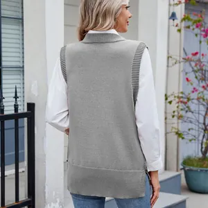 Detailed back view of a grey knitted sweater vest layered over a stylish white shirt.