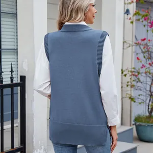Detailed back view of a blue sleeveless knitted sweater vest featuring side slit hem