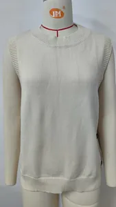 Detail of white knitted sleeveless vest featuring ribbed crew neck and side buttons
