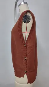 Side view of terracotta knit vest with decorative buttons and side slit