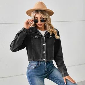 Detailed view of women's black washed short denim jacket on model with fedora hat
