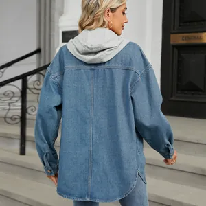 Detailed back view of a loose washed denim jacket with a grey hood and curved hem