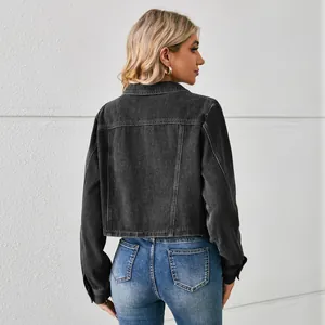 Back view of a women's black washed denim short jacket with long sleeves and casual fit