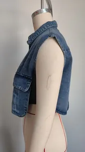 Detailed side profile view of a cropped blue washed denim vest with pocket on mannequin