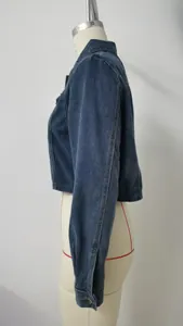 Detailed side profile view of a vintage dark blue washed denim cropped jacket for women