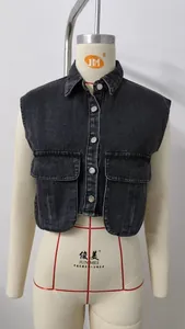 Close-up of a black washed denim vest with double chest pockets on a mannequin