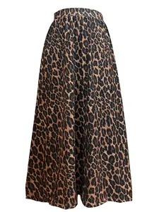 Detail view of a leopard print A-line maxi skirt with elegant draping and elastic waist.