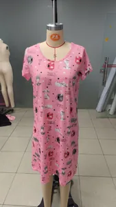 Close-up detail of a pink short-sleeve sleep dress featuring cute cat print patterns.
