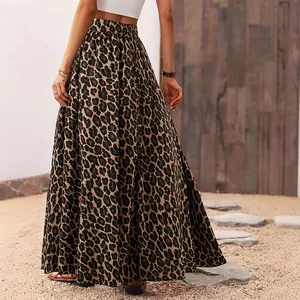 Back view of a stylish leopard print maxi skirt set in a natural sandy outdoor scene