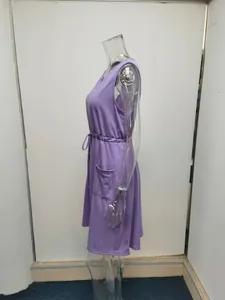 Detailed side profile of a purple sleeveless summer tank dress on clear mannequin