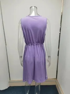 Back view of a purple sleeveless summer tank dress featuring a cinched elastic waist