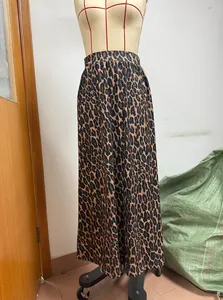 Close-up view of leopard print midi skirt on mannequin showing fabric and fit details