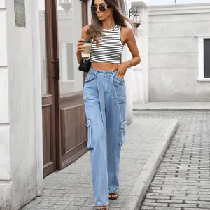 Detail view of light blue high-waisted denim cargo pants with multiple utility pockets