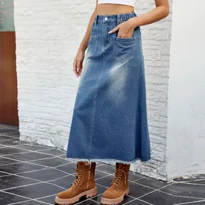 Detailed view of high waisted washed blue denim midi skirt with frayed hem and pockets