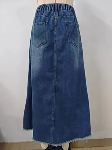 Detailed back view of a washed blue denim midi skirt featuring a raw hem and back pockets