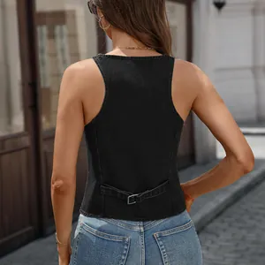 Detailed back view of a black denim vest featuring an adjustable buckle strap