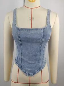 Front view detail of a light blue washed denim corset crop top on a white mannequin