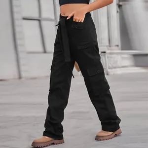 Detail view of black high-waist cargo pants with multiple utility pockets and belt.