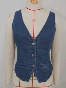 Close-up detail of washed blue denim vest with three silver buttons on mannequin