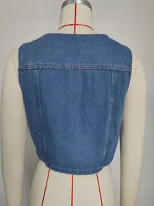 Close-up back view detail of a washed blue casual denim vest on a tailor mannequin