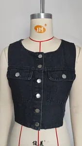 Close-up of a washed black denim vest with round neck and silver buttons on mannequin