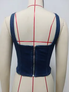 Detailed back view of a slim-fit washed denim corset vest featuring a silver zipper