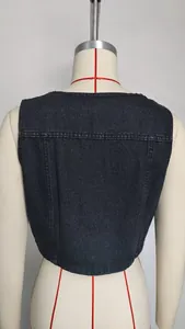 Macro view of the back stitching detail on a washed dark gray denim vest for women