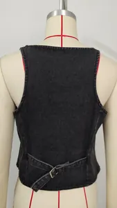 Detailed back view of a washed black denim vest featuring an adjustable buckle strap
