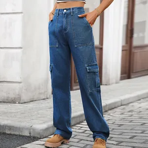 Detail of blue washed denim cargo pants with side pockets and elastic waist