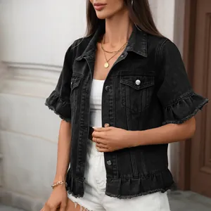 Detailed shot of a black short-sleeved denim jacket with ruffled hem and washed finish