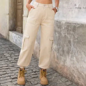 Detailed outdoor view of beige high-waisted cargo pants with utility side pockets