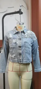 Front view of a distressed denim jacket with leopard print on a mannequin