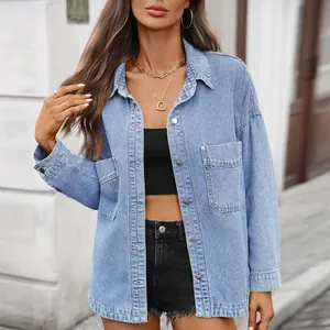 Stylish oversized light blue wash denim shirt with flap pockets and vintage casual look