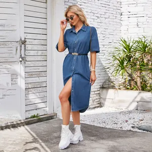 Outdoor detail shot showing the full fit and style of the washed denim midi dress.