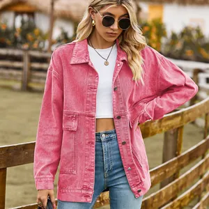 Vintage style pink acid-wash denim jacket shown on model with rustic farm background