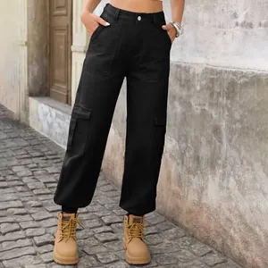 Detailed view of women's black cargo denim pants with side pockets and elastic hem.