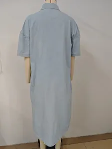 Back view of light blue washed denim short sleeve maxi dress in oversized fit