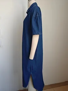 Side view of a loose washed denim short-sleeve midi dress with a stylish side slit detail.